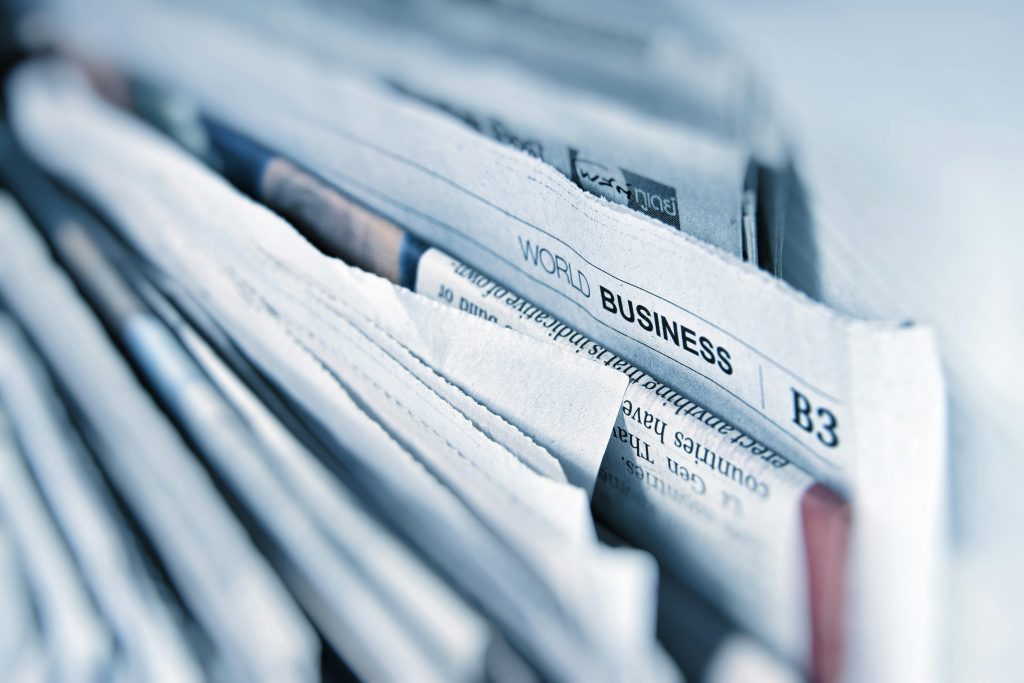 A close up of a stack of newspapers