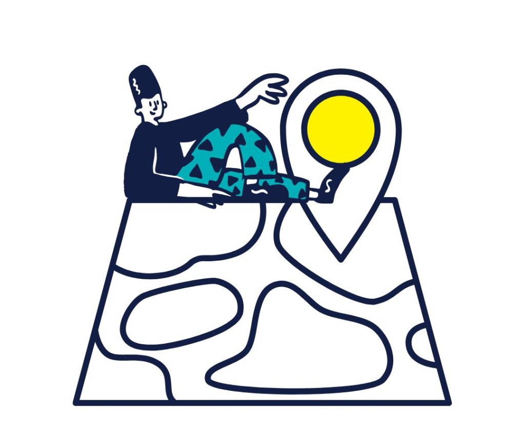 Person sitting on top of a map