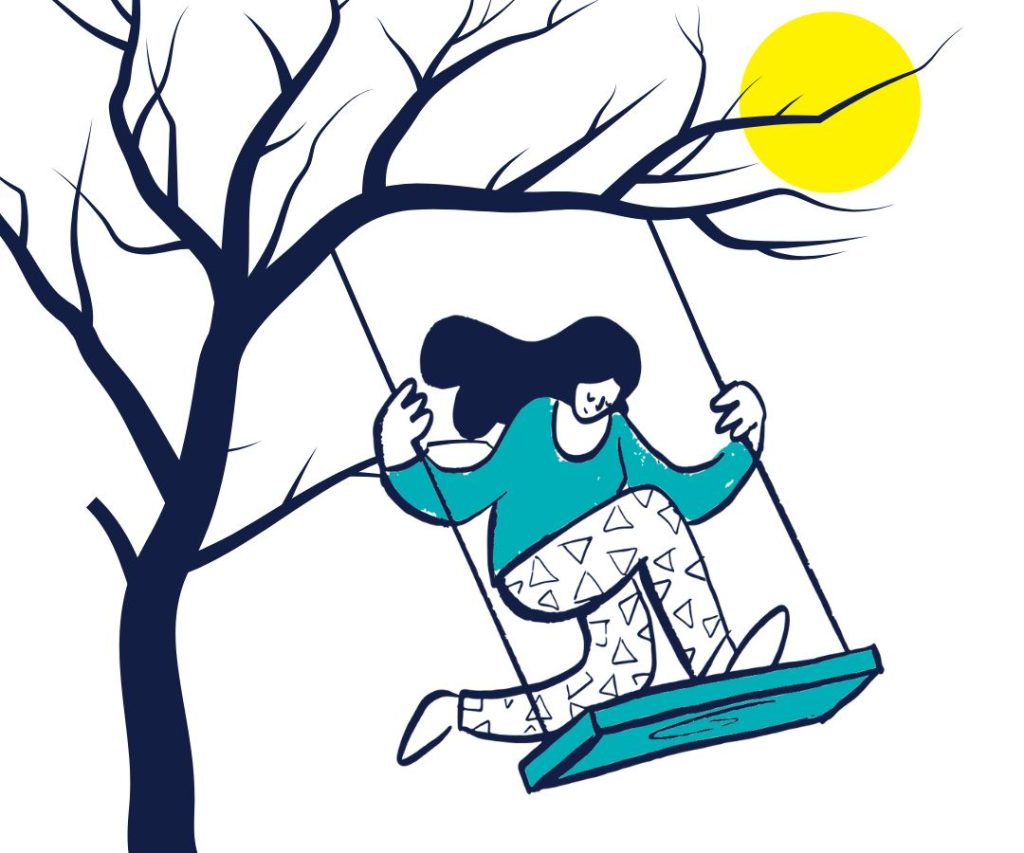 Person swinging from a tree