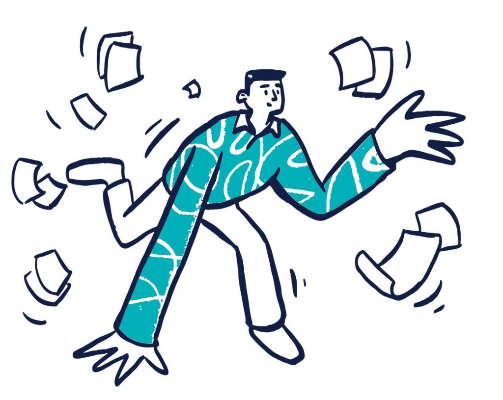 A man tripping with paper being scattered in the air